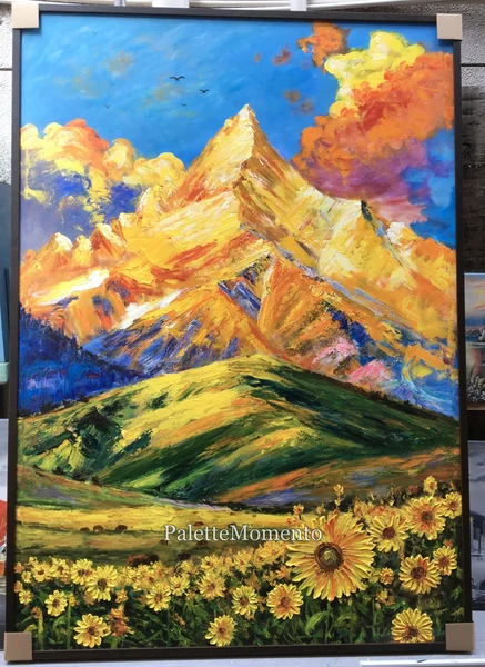 Framed painting of golden mountains and sunflowers with visible paint texture and corner protectors