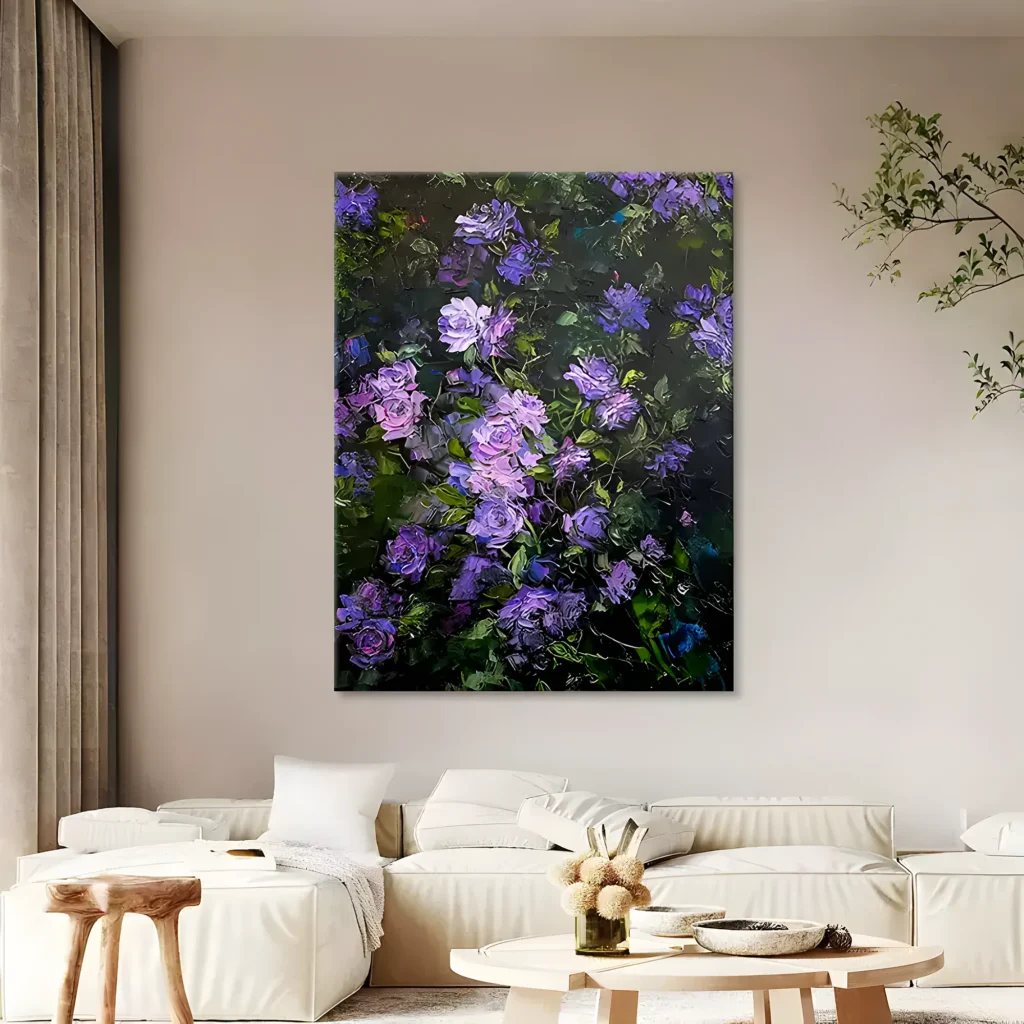 Purple rose canvas wall art with lavender petals and deep green foliage built up in heavy impasto, centered on a cream wall above an ivory linen sofa and round wooden coffee tables in a warm living room