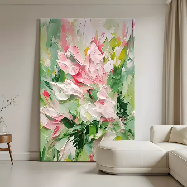 Pink roses and green leaves impressionist painting displayed as framed wall art in a modern living room
