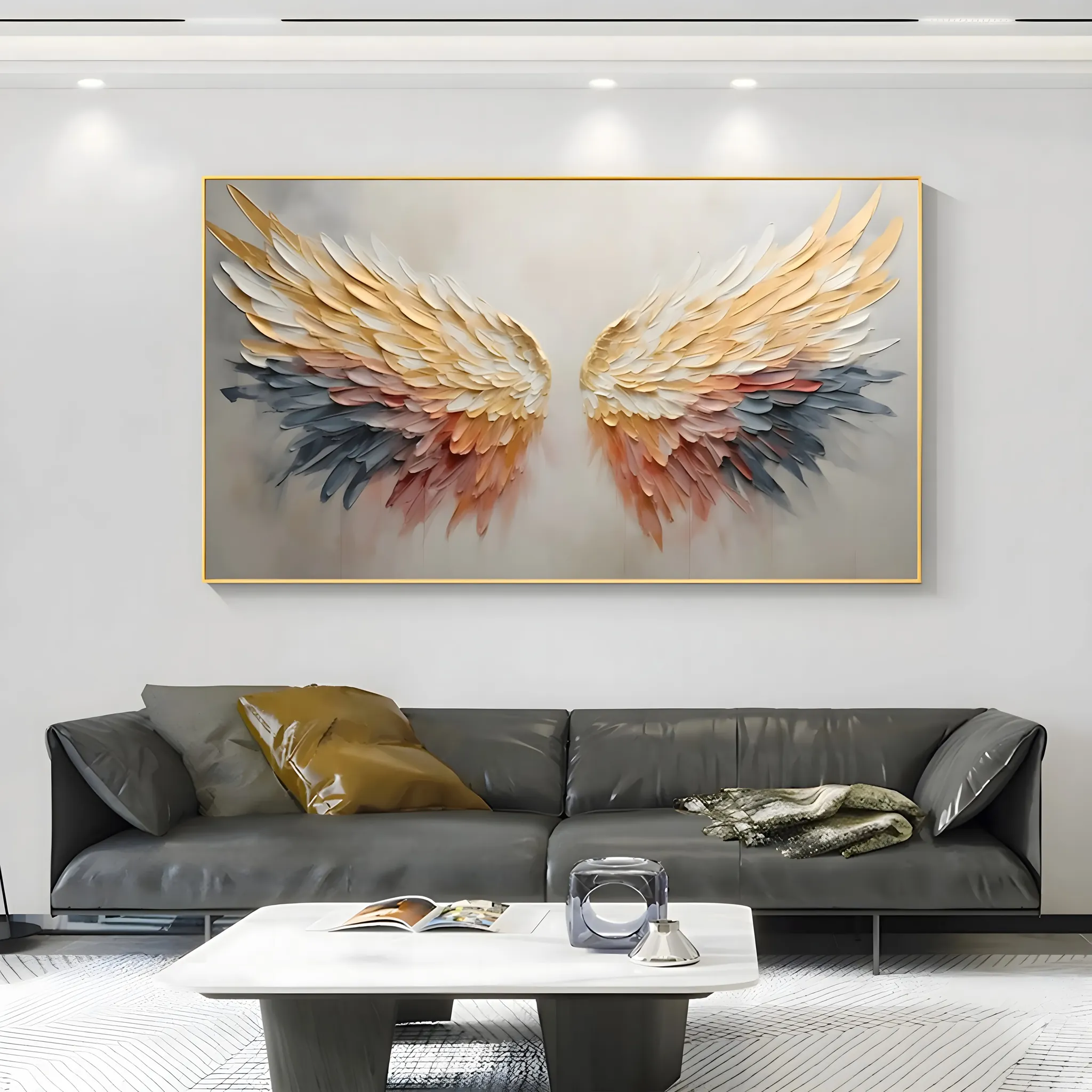 A large horizontal textured painting of a pair of angel wings in gold, orange and blue-gray, built in raised sculptural relief, the feather ridges catching the light against a soft beige ground.