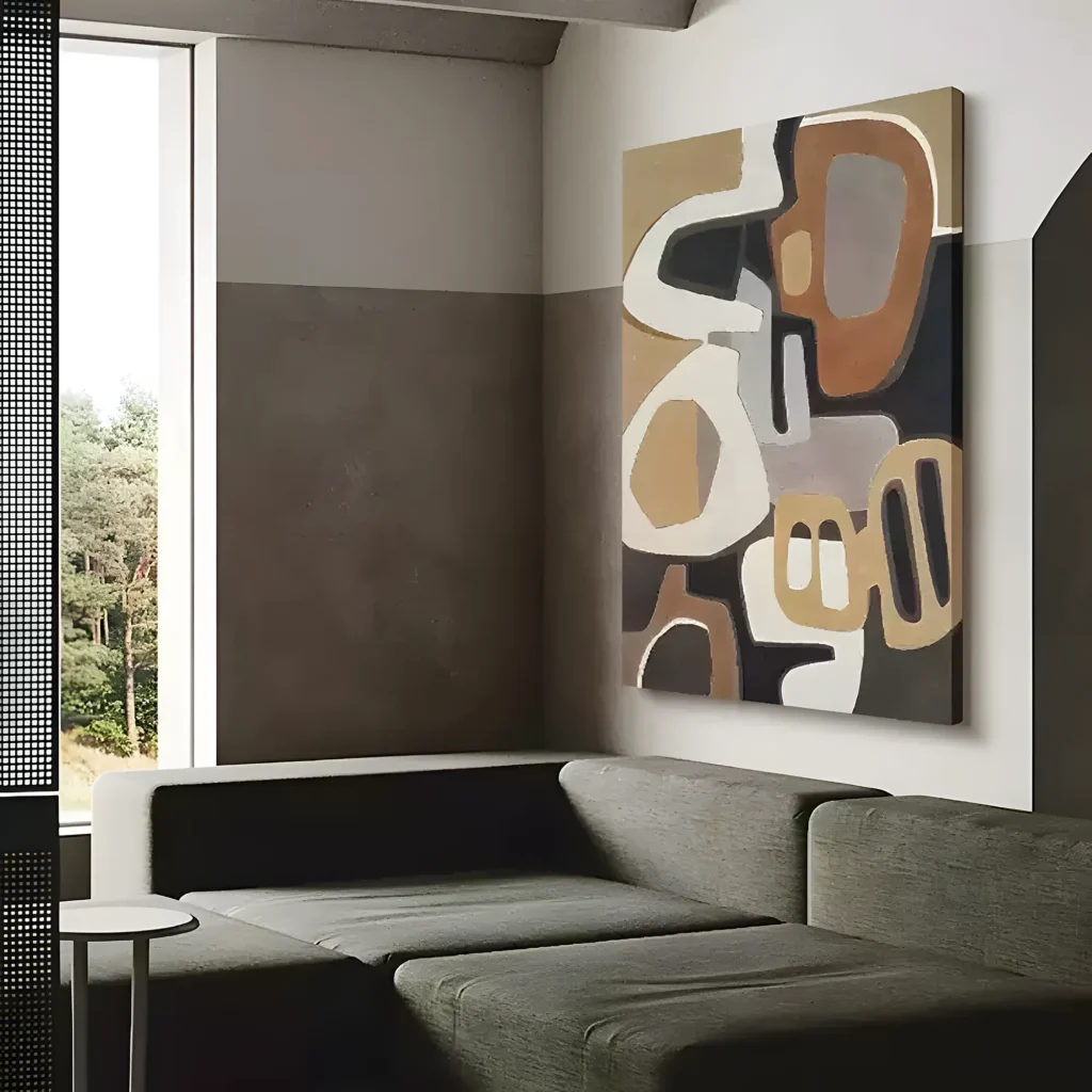 Brown and cream organic oval wabi-sabi painting displayed as framed wall art in a bright living room