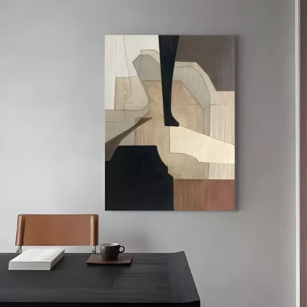 Tan and black earthy geometric wabi-sabi painting displayed as framed wall art in a modern living room