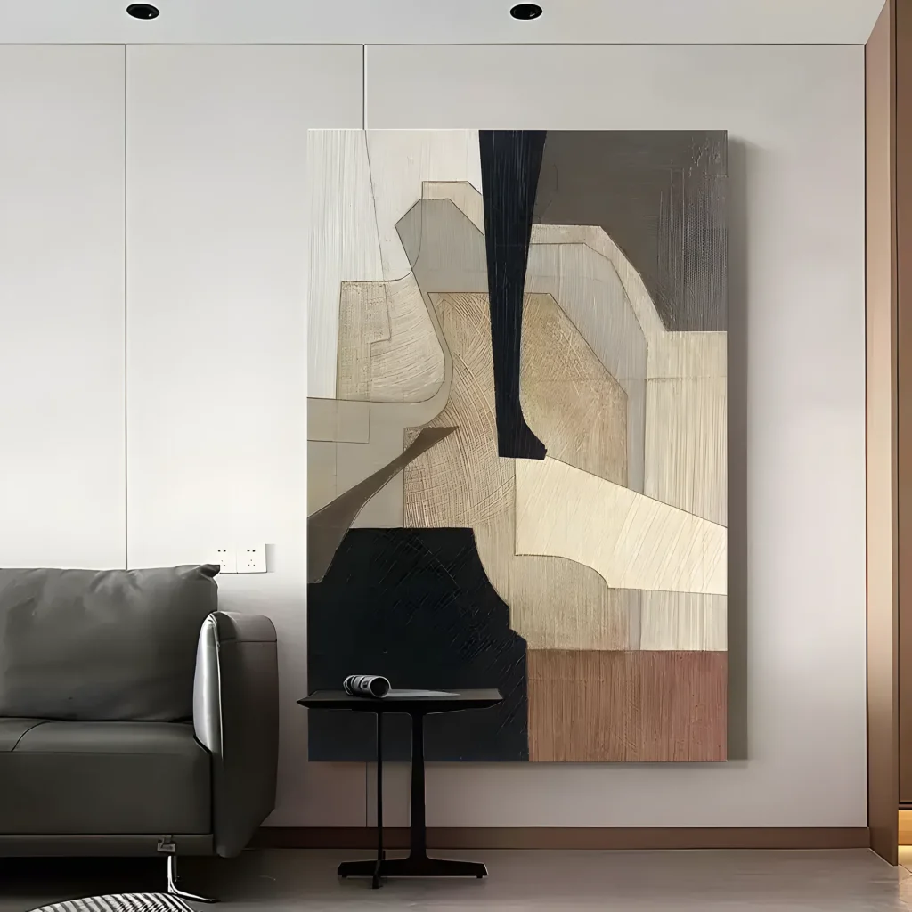 Tan and black earthy geometric wabi-sabi painting displayed as framed wall art in a bright living room