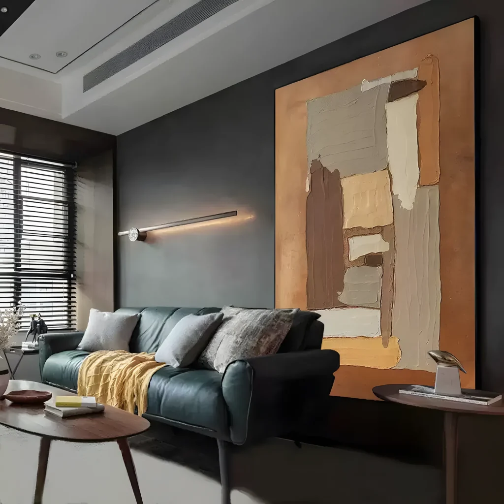 Brown and tan torn-paper wabi-sabi painting displayed as framed wall art in a scandinavian living room