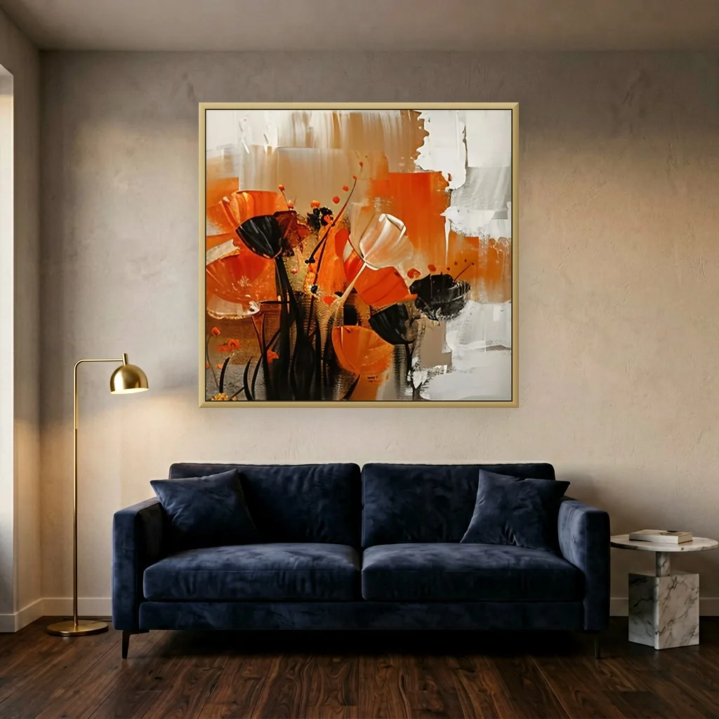 Square canvas painting of rust orange poppies with black seed heads and stems on a brushed white and taupe ground, hung above a navy velvet sofa between a brass floor lamp and a marble side table