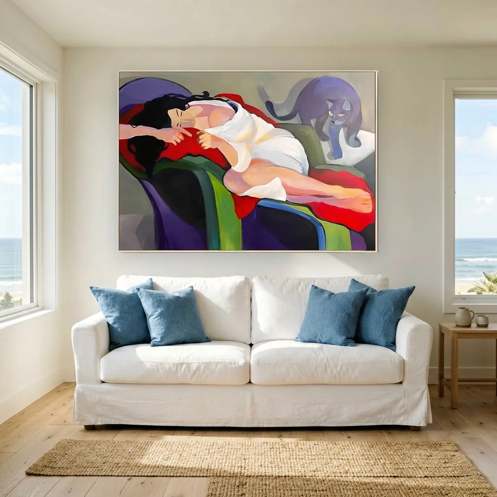 A woman reclining with a violet cat, hung above a white slipcovered sofa in a coastal living room