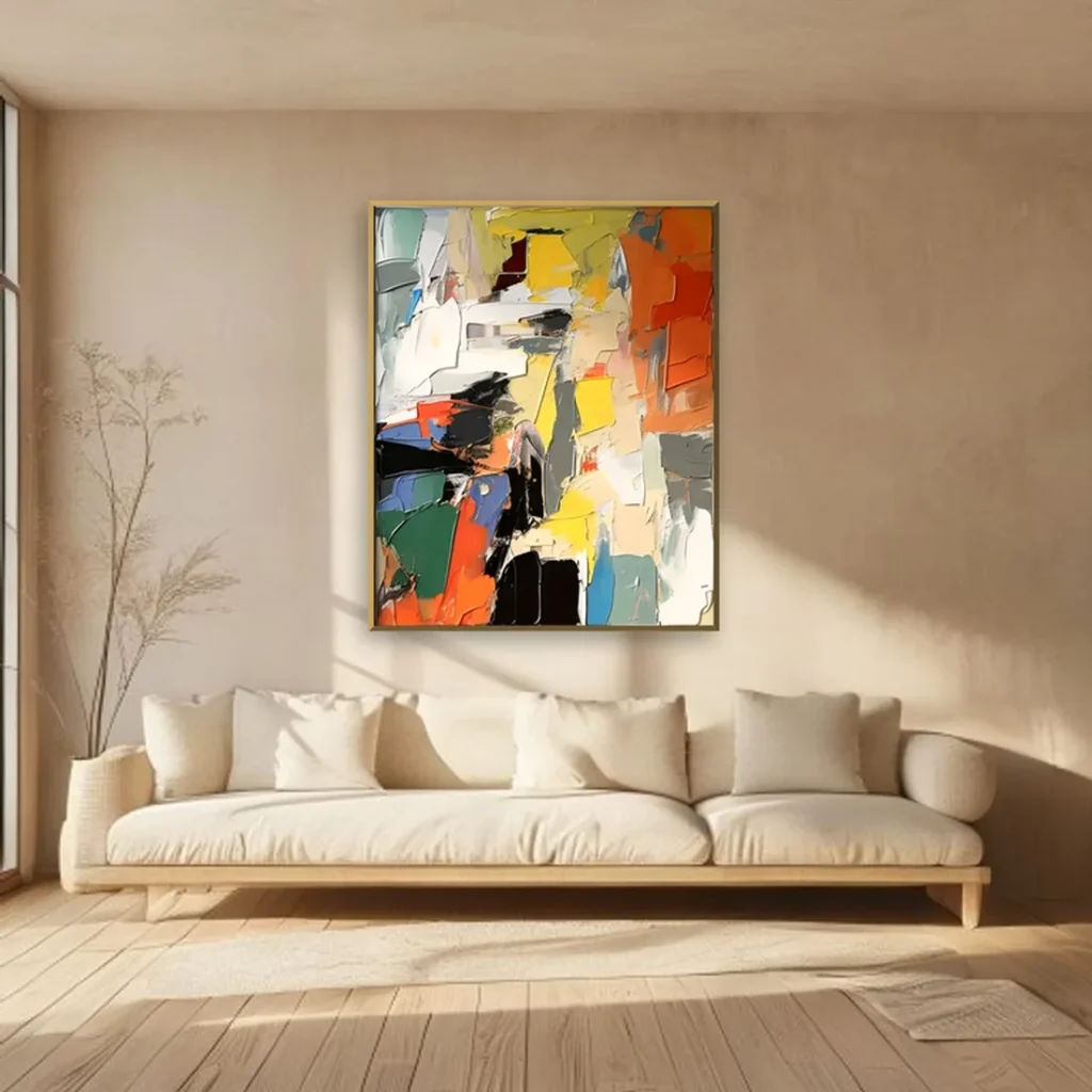 Multicolor expressionist wall art in thick palette-knife slabs of yellow, red orange, green, and blue, gold framed on a warm beige plaster wall above a cream linen sofa in a japandi living room