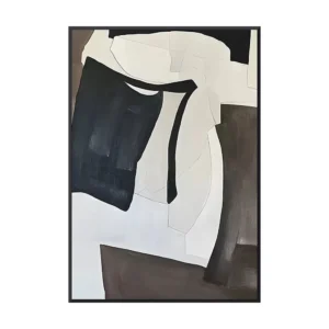 Bold acrylic abstract of navy black and cream torn shapes over a dark brown column, framed in thin black on a white wall above a gray sofa and tan chair, minimalist black and white canvas wall art