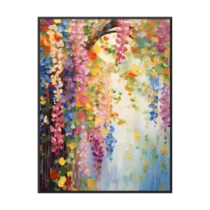 Palette-knife oil painting of a flowering tree canopy dripping pink, blue and yellow blossoms, hung in a black frame on a slate ribbed wall above a deep green sofa, colorful floral canvas wall art