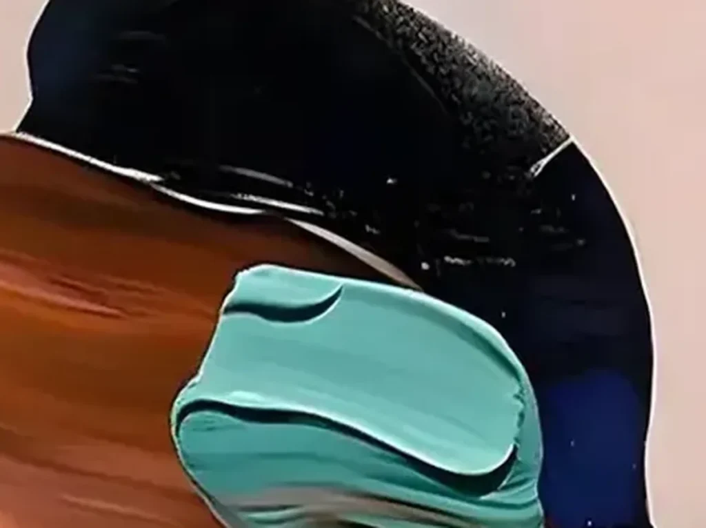 Close-up of thick teal, copper, and navy palette-knife slabs forming the abstract woman in textured figure painting AA06