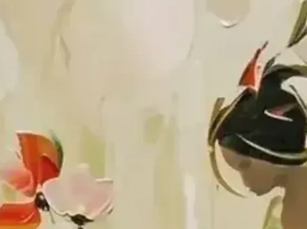 Close-up of the emerald and chartreuse skirt in the palette-knife dancer painting CA31, showing thick knife strokes with coral and white flecks standing off the canvas.