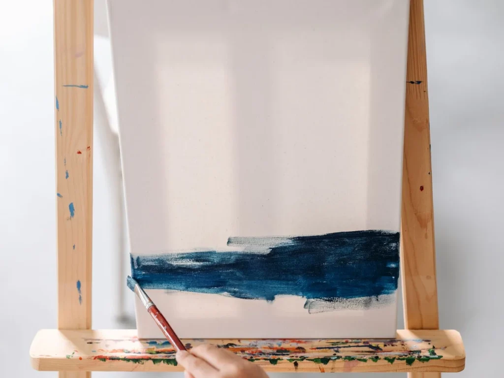 First strokes of a made-to-order painting taking shape on the studio easel