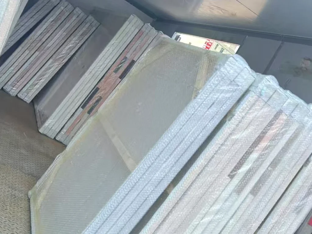 Bubble-wrapped canvases loaded for dispatch from our workshop