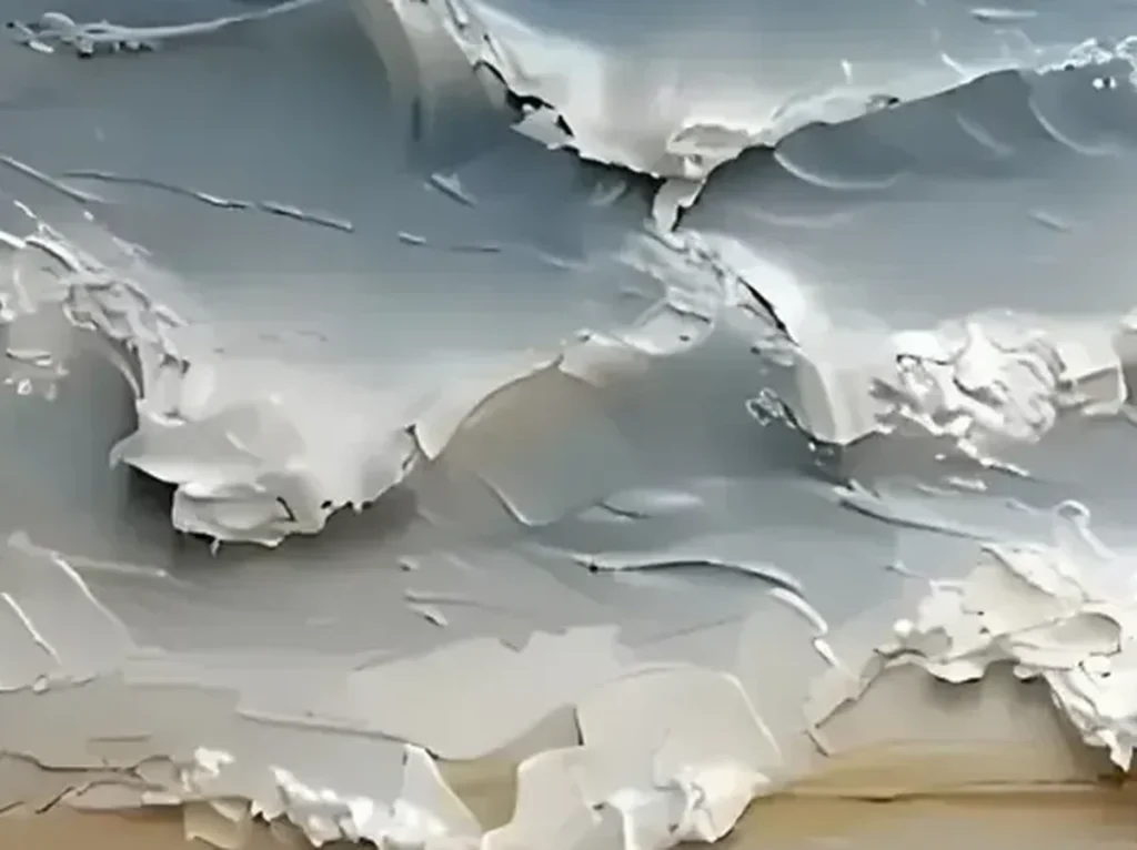 Close-up of the thick, torn white foam ridges breaking over warm beige sand on the TA03 shoreline textured canvas.