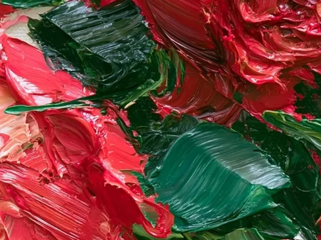 Close-up detail of thick palette knife strokes forming red rose petals and green leaves, textured rose canvas TA22