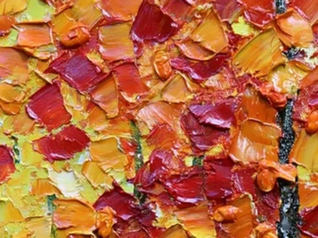 Close-up of the heavy impasto autumn canopy in painting TA44, showing crimson, orange, and gold leaves built up as separate raised palette-knife strokes.