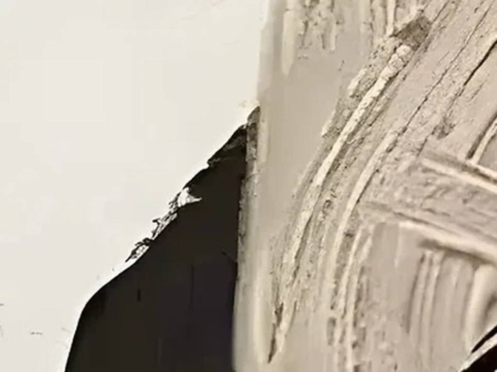 Close-up of the rust mass and combed white ridges on wabi-sabi canvas WA02