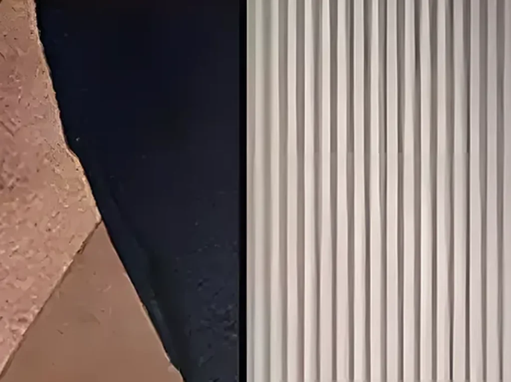 Extreme close-up of the raised seams and plaster-like grain where the brown and navy fields meet on wabi-sabi canvas WA12