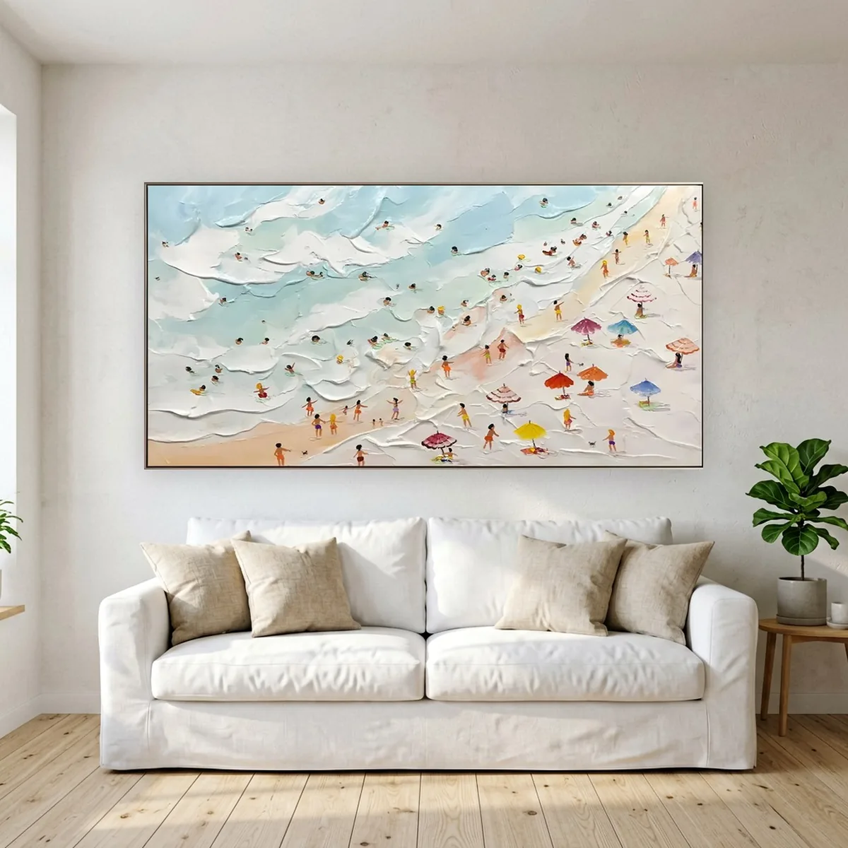 Large horizontal beach aerial painting hung above a white sofa, showing the ideal wall art size of about two thirds to three quarters of the sofa width in a bright coastal living room.