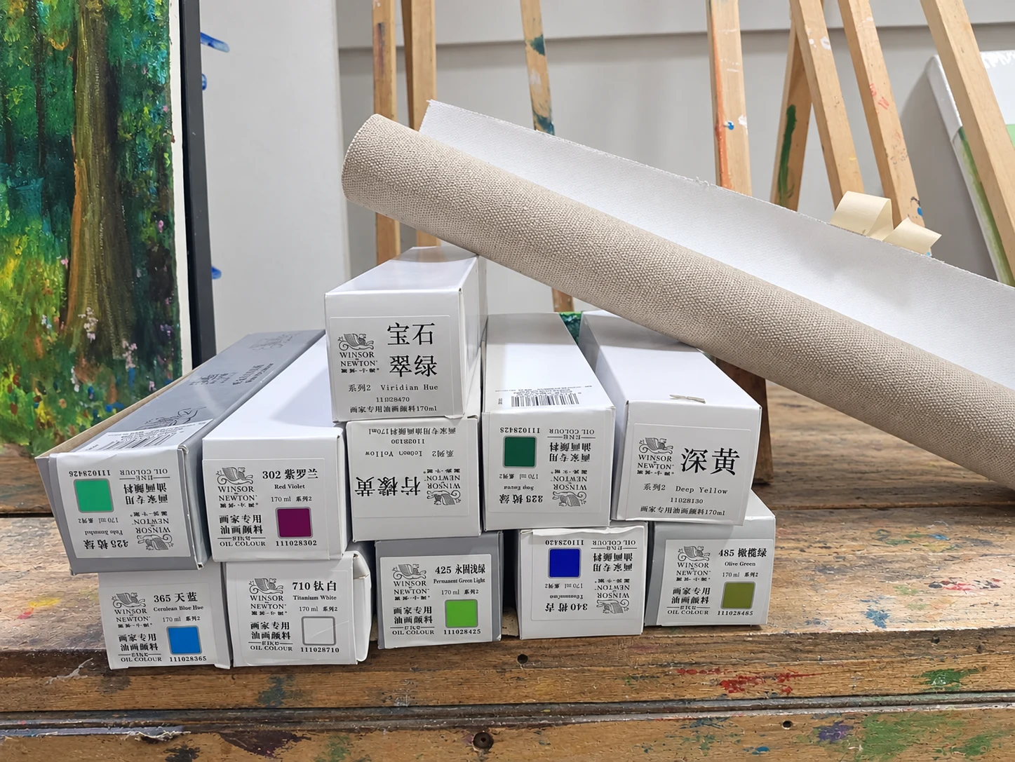 Canvas and oil paints on the studio workbench.