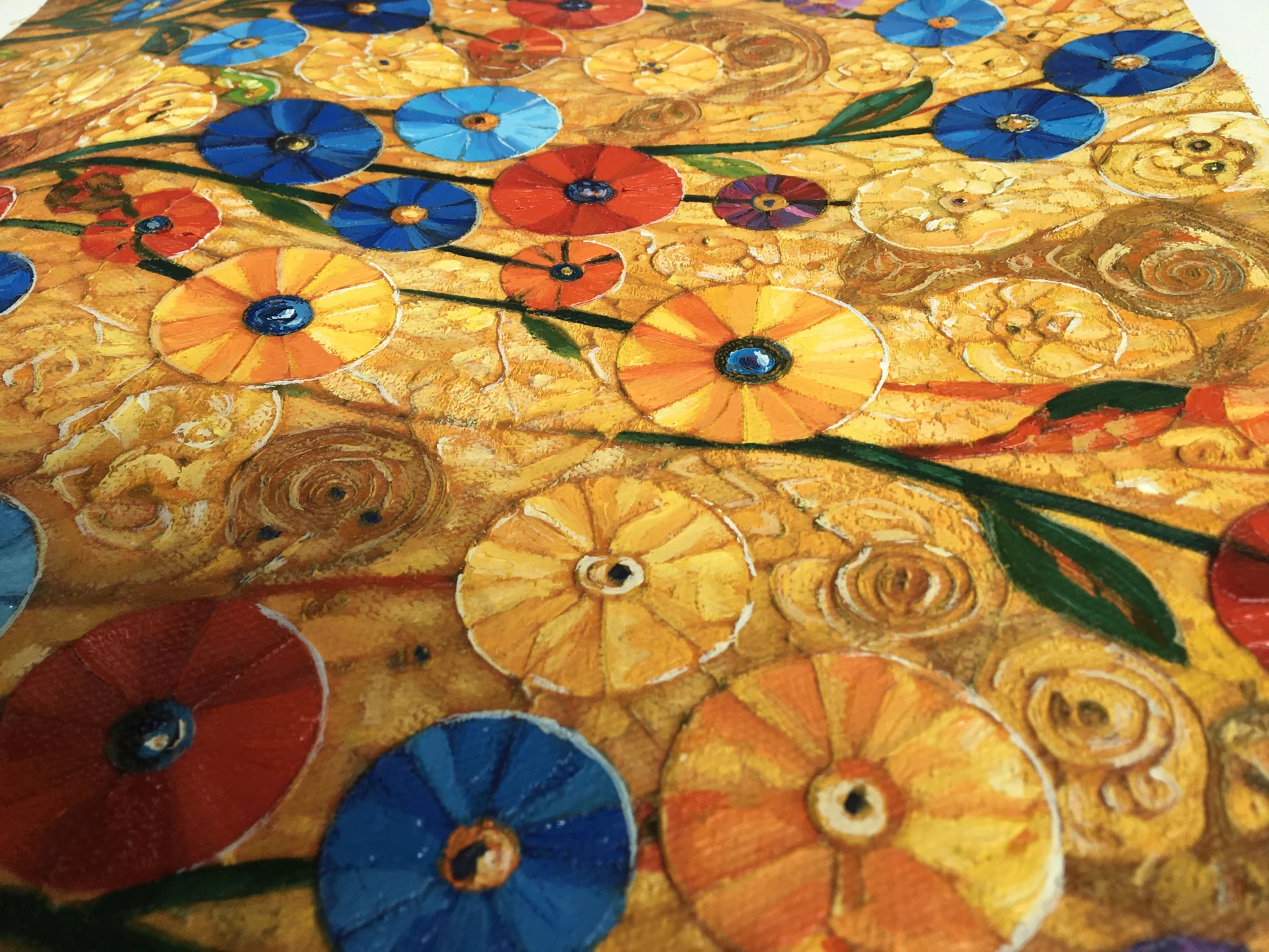 Angled close-up showing raised paint and layered texture in the finished floral painting.