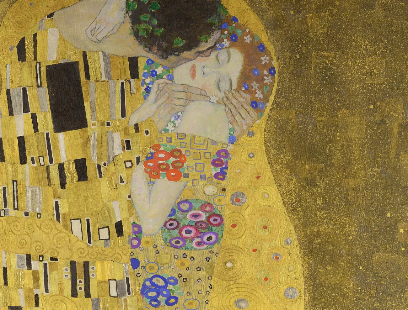 Detail of Gustav Klimt's The Kiss, showing soft painted faces beside gold ornament and geometric pattern.