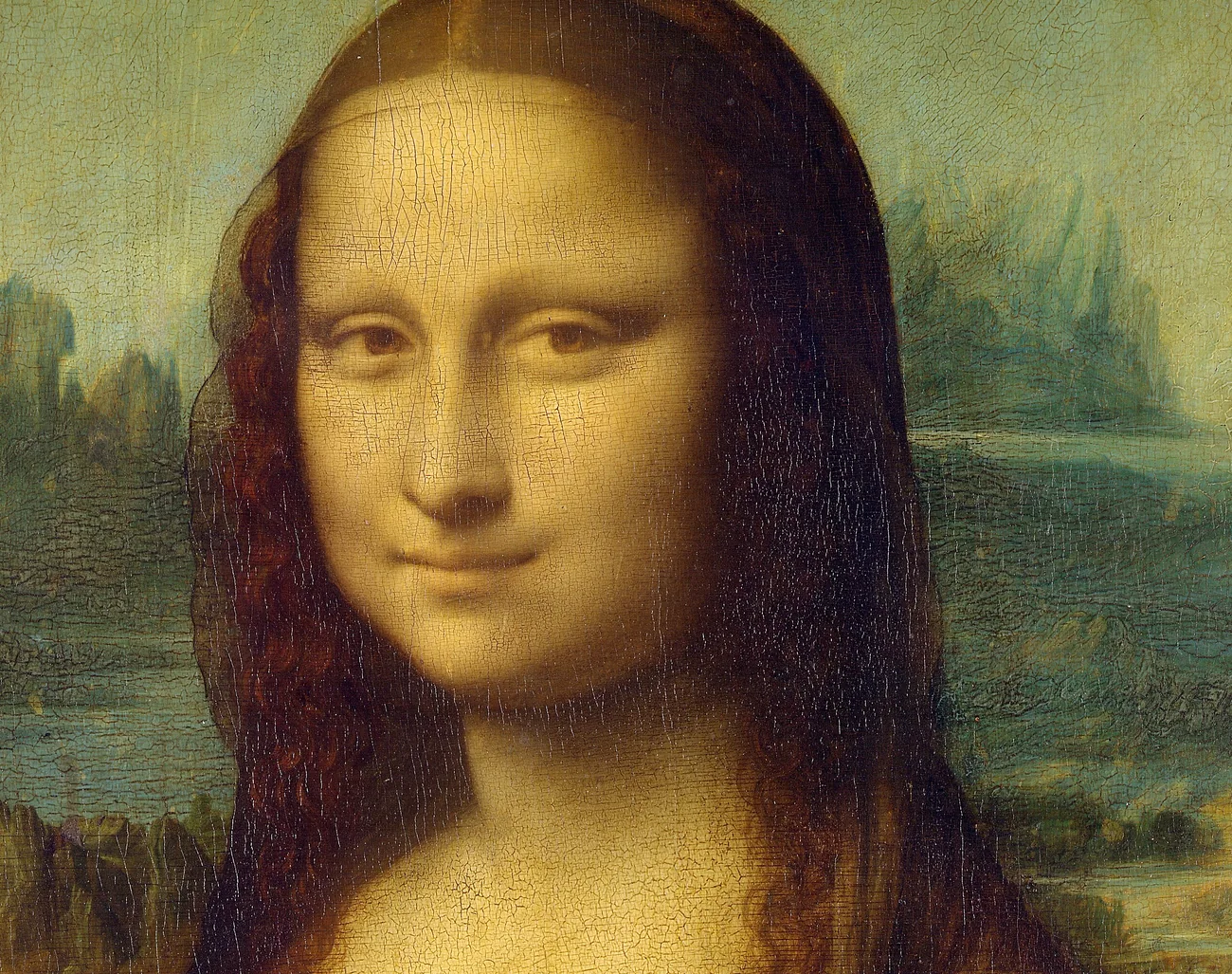 Detail of the Mona Lisa face, showing the soft transitions around the eyes and mouth and the hazy landscape behind the sitter.
