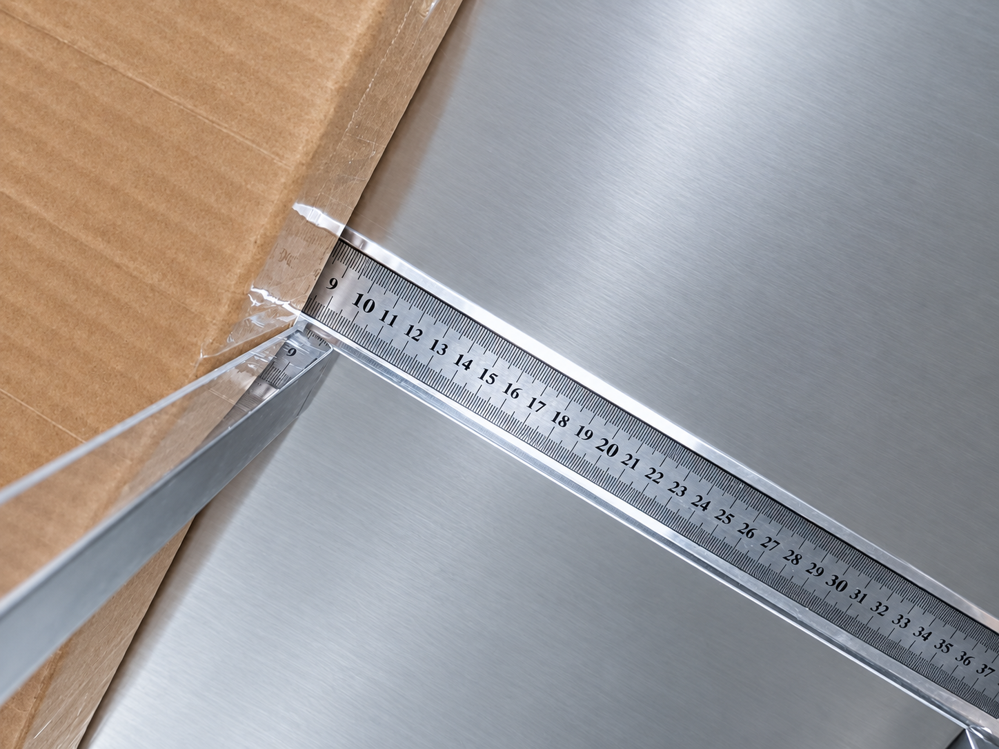 Close measurement of the packed box edge before shipment.