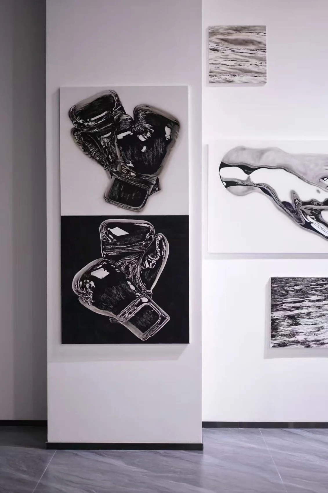 Black-and-white artworks displayed on the PaletteMomento studio walls.