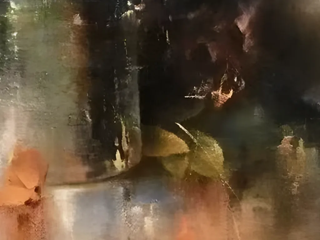 Close-up of the base of the glass jar with olive and gold leaves at its foot and a fallen orange petal reflected in the blue gray tabletop of still life IA125