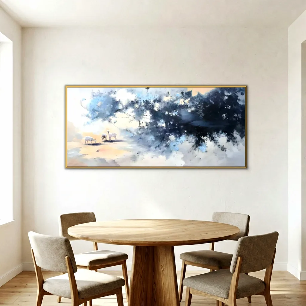 Panoramic goat and blossom painting in a thin gold frame on a warm white dining room wall above a round oak pedestal table with four taupe upholstered chairs