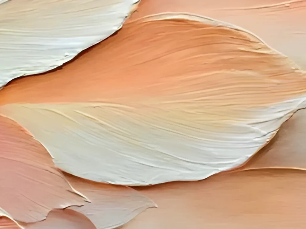 Close-up of one apricot and cream feather in textured painting TA47, its raised knife edge and fine combed lines catching side light above softer coral shapes